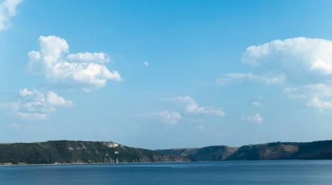 Blue sky and clouds over the fjord. Time lapse. Stock Footage 67669281