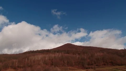 Blue sky and clouds over the mountain Stock Footage 70430379