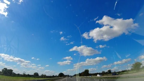 Blue Sky and Clouds over England During Car Drive Stock Footage 320810661
