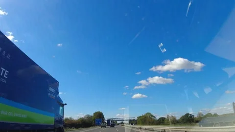 Blue Sky and Clouds over England During Car Drive Stock Footage 320901290