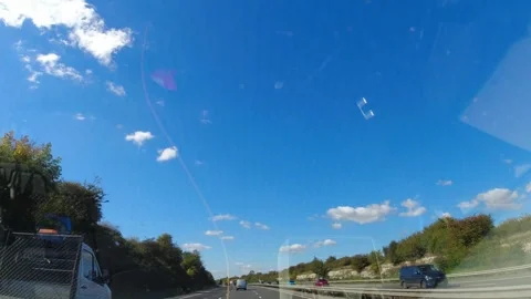 Blue Sky and Clouds over England During Car Drive Stock Footage 320916262