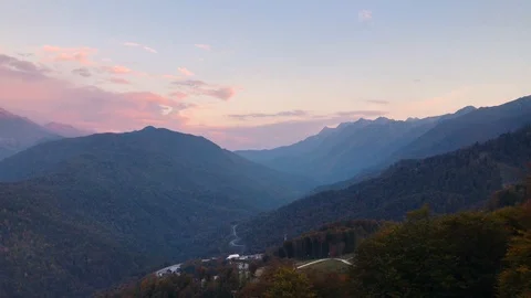 Blue sky and clouds painted pink sunset in highlands Stock Footage 106853669
