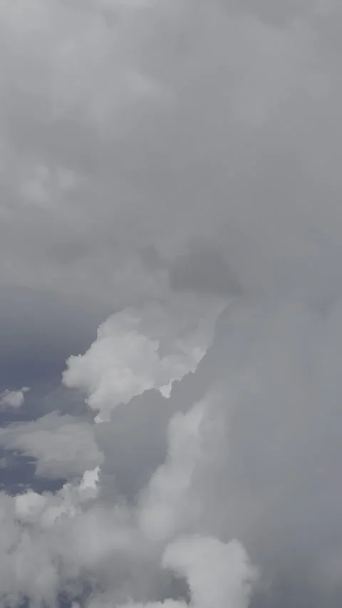 Blue sky and clouds passing by an airplane window Stock Footage 327143341
