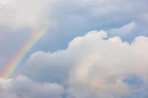 Blue sky and clouds with a rainbow. rainbow in the sky. Stock Photos