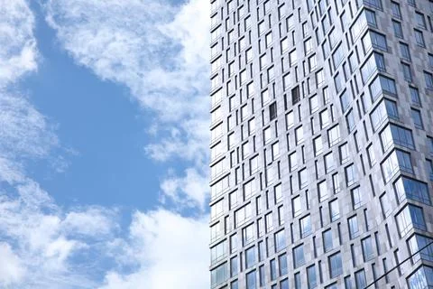 Blue sky and clouds reflected in the building Stock Photos
