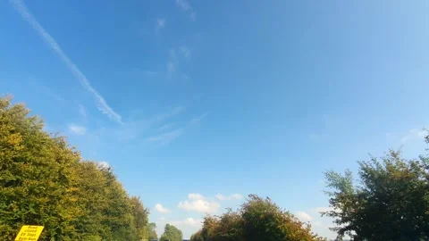 Blue Sky and Few Clouds over England During Car Drive Video stock 320147159
