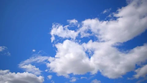 Blue sky and floating clouds Stock Footage 124649137