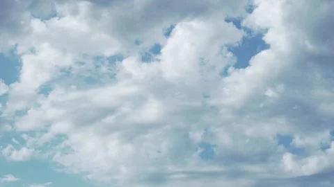 Blue Sky and Floating White Puffy Cumulus Clouds on a Clear Cloudy Summer Aftern Stock-Footage 153807775