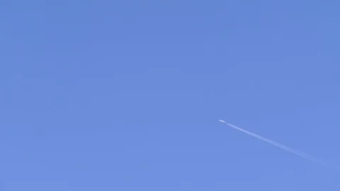 Blue sky and jet contrail ( Vapor trail ) Stock Footage 122776791