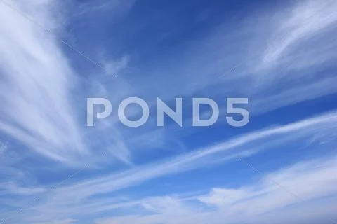 Blue sky and light white summer clouds Stock Photos