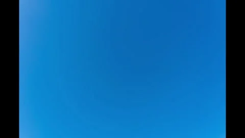 Blue sky and moving clouds timelapse on a Spring day in the UK Video stock 274477394
