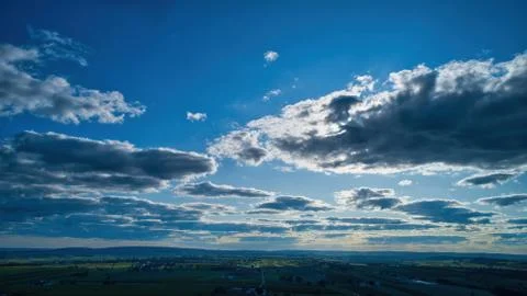 Blue sky and multiple clouds background Stock Photos