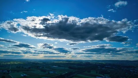 Blue sky and multiple clouds background Stock Photos