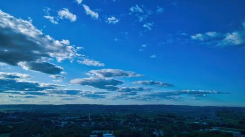 Blue sky and multiple clouds background Stock Photos