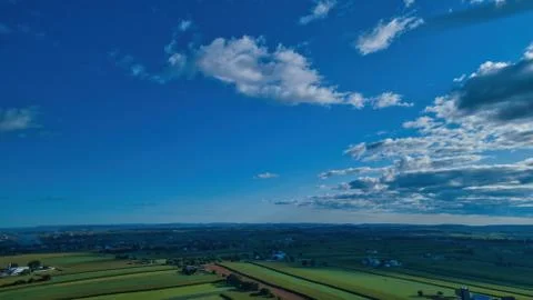 Blue sky and multiple clouds background Stock Photos
