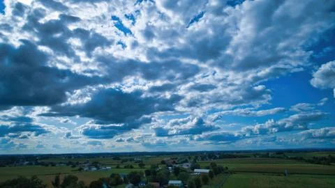 Blue sky and multiple clouds background Stock Photos