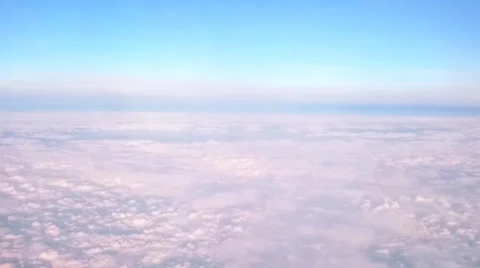 Blue Sky and passing clouds from above Stock Footage 61777514