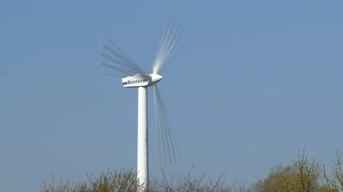 Blue sky and rotating wind turbine - time lapse Stock Footage 106699881