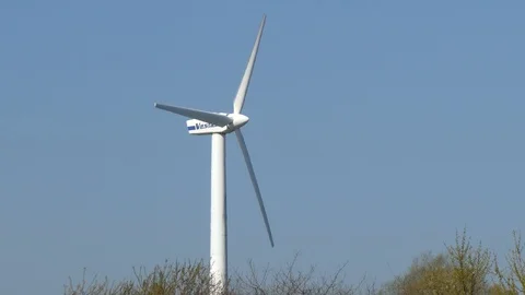 Blue sky and rotating wind turbine Stock Footage 106701422
