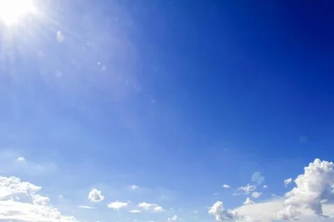 Blue sky and sun Stock Photos