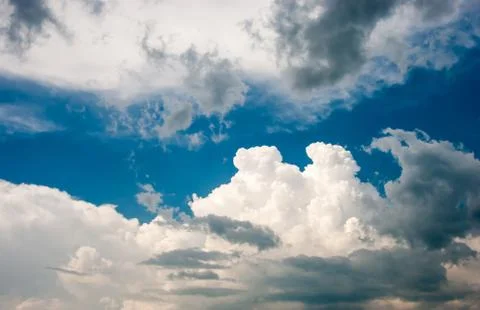 Blue sky and various cloud formations Stock Photos