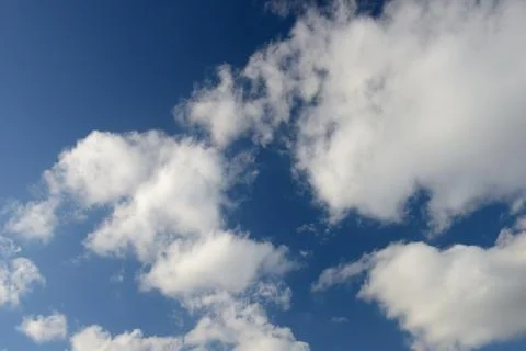 Blue sky and various cloud formations Stock Photos
