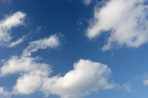 Blue sky and various cloud formations Stock Photos