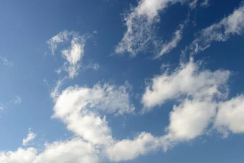 Blue sky and various cloud formations Stock Photos