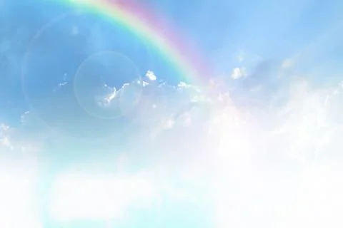 Blue sky and white cloud with sun light and rainbow Stock Photos