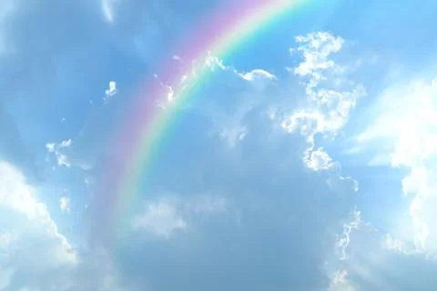 Blue sky and white cloud with sun light and rainbow Foto stock