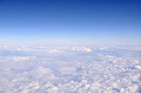 Blue sky and white cloud, view from airplane windows. Stock Photos