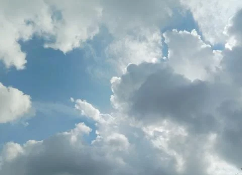 Blue sky and white cloud background closeup. Stock Photos