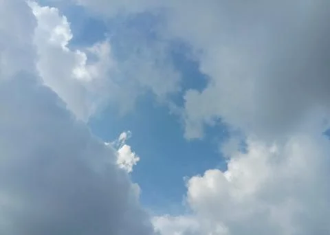 Blue sky and white cloud background closeup. Stock Photos