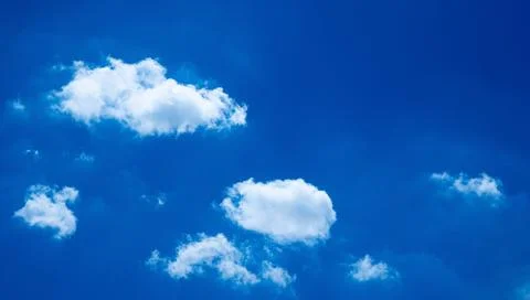 Blue sky and white cloud use for background. The sky is bright blue with wh.. Stock Photos