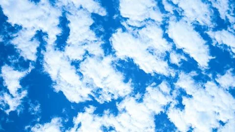 Blue sky and white cloud use for background. The sky is bright blue with wh.. Stock Photos