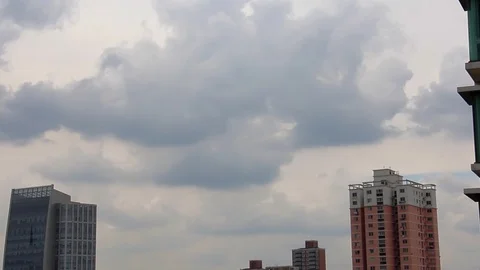 Blue sky and white clouds on the upper floors of residential quarters Stock Footage 95983125