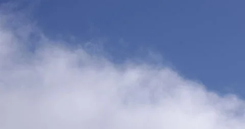 Blue Sky and White Clouds Drifting By Close Up 4K 6 Stock Footage 137572937