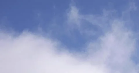 Blue Sky and White Clouds Drifting By Close Up 4K 11 Stock Footage 137594684