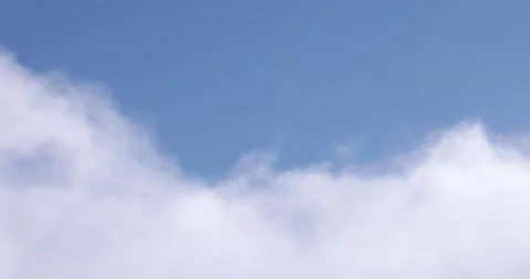 Blue Sky and White Clouds Drifting By Close Up 4K 2 Stock Footage 137602724