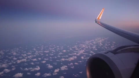 Blue sky and white clouds view from porthole airplane at sunrise dawn. clouds Stock Footage 239514460