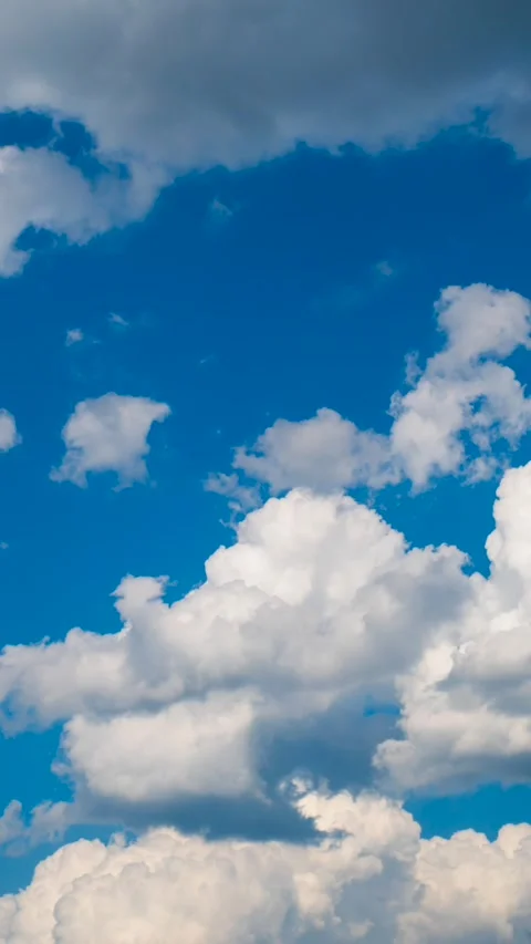Blue sky and white clouds, vertical time-lapse Stock Footage 283815406