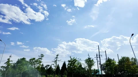 Blue Sky and White Clouds Through Car Window Stock Footage 317475155