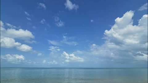 Blue sky and white clouds over sea time-lapse Stock Footage 330938527