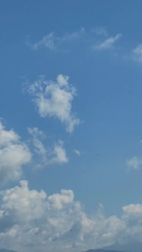 Blue Sky and White Clouds Vertical Background Stock Footage 346786646
