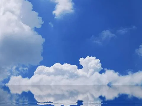 Blue sky and white clouds reflected on the water surface. Stock Photos
