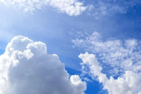 Blue sky and white clouds with sunlight,Blue sky and floating clouds Stock Photos