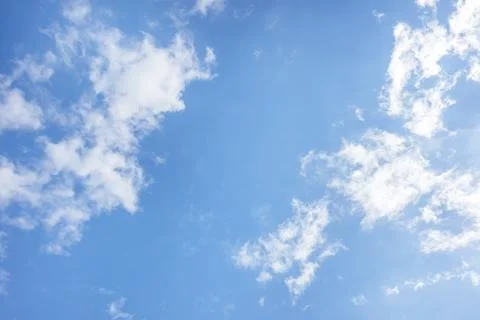 Blue sky and white clouds with sunlight,Blue sky and floating clouds Stock Photos