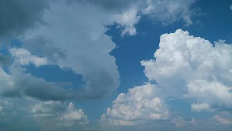 Blue sky and white clouds are impressive. Sunny blue sky in tropical summer or Stock Photos