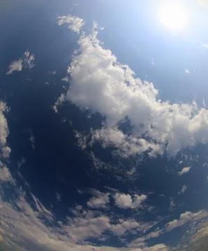 The blue sky and white clouds with the sun perfect as a concept of paradise.. Stock Photos