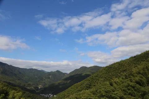 Blue sky and white clouds, green mountains under the blue sky, a japanese-s.. Stock Photos